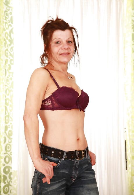 Superb grandma Ludmila in tight jeans spreads her legs 